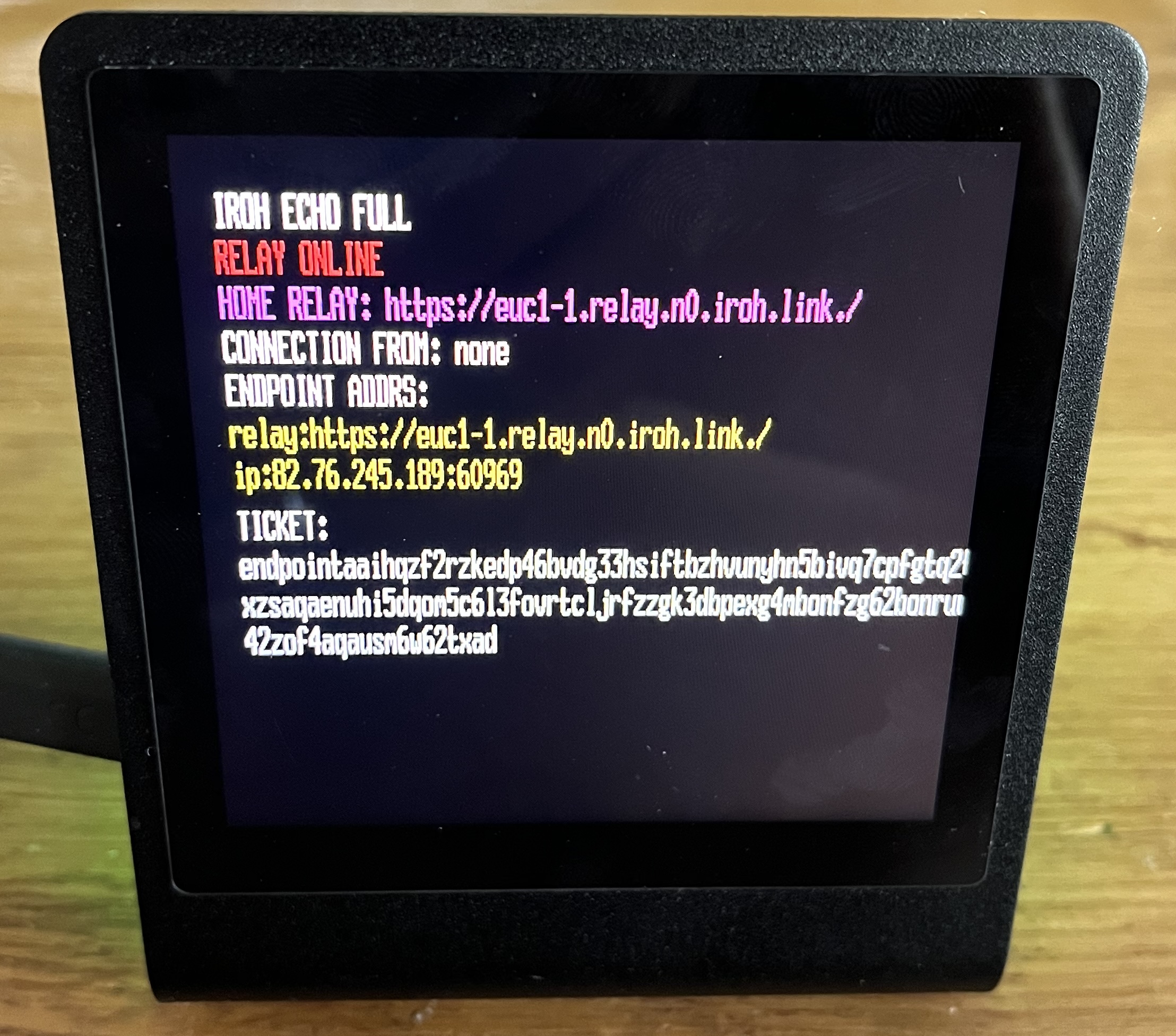 The Pimoroni Presto running the iroh echo example, showing its endpoint addresses and ticket on the display